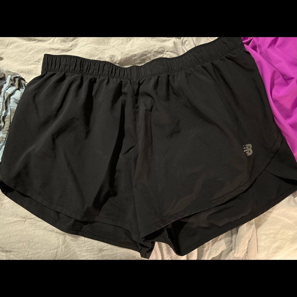 Black New Balance running shorts.